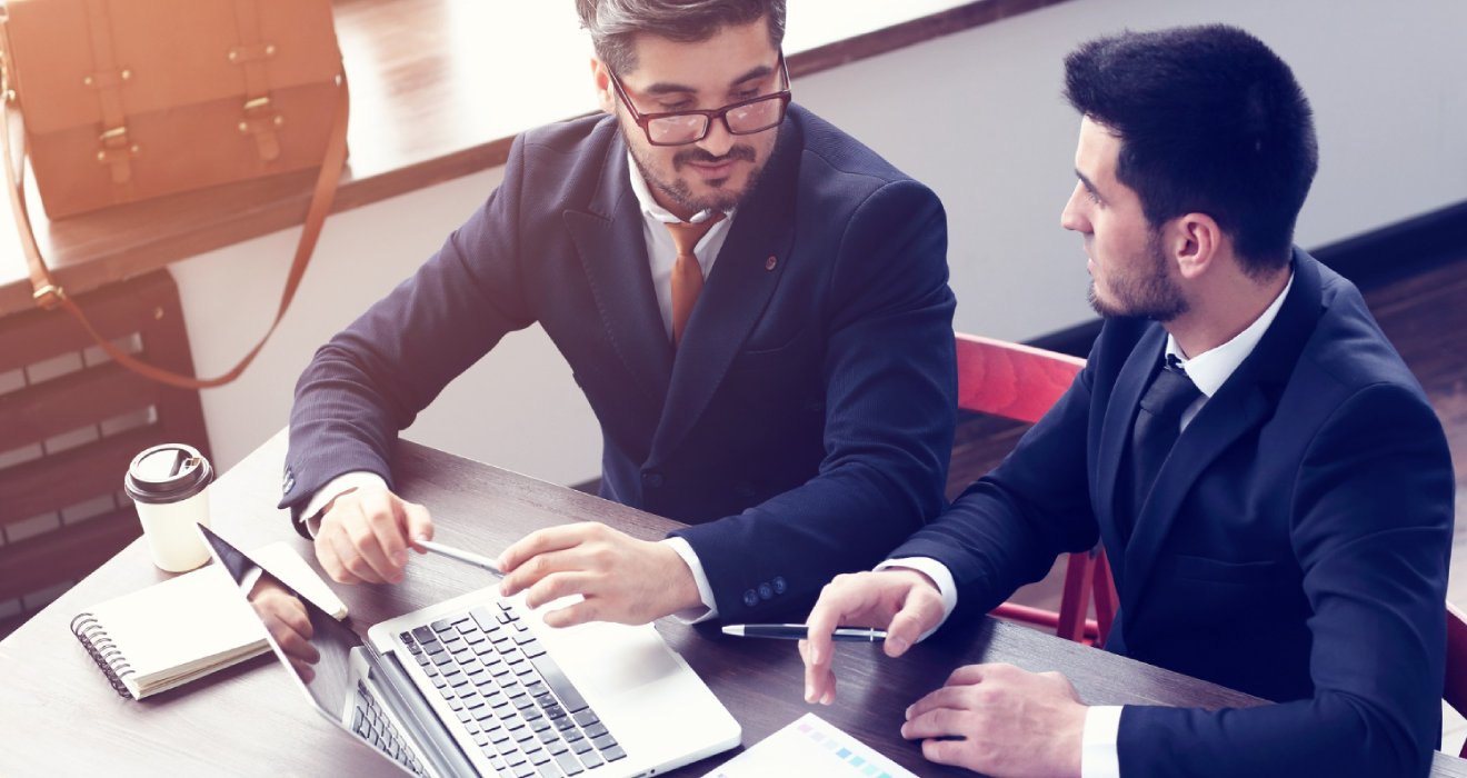 two-young-businessmen-working-laptop-modern-office-beard-hipster-businessmen-film-effect-lens-flare